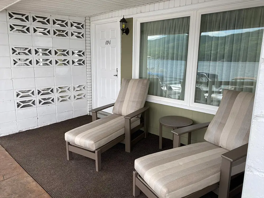 Motel room porch with 2 chaise lounges